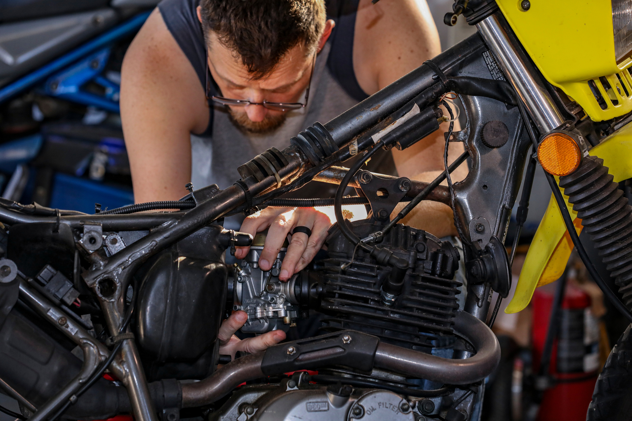 A Man Fixing a Motorcycle